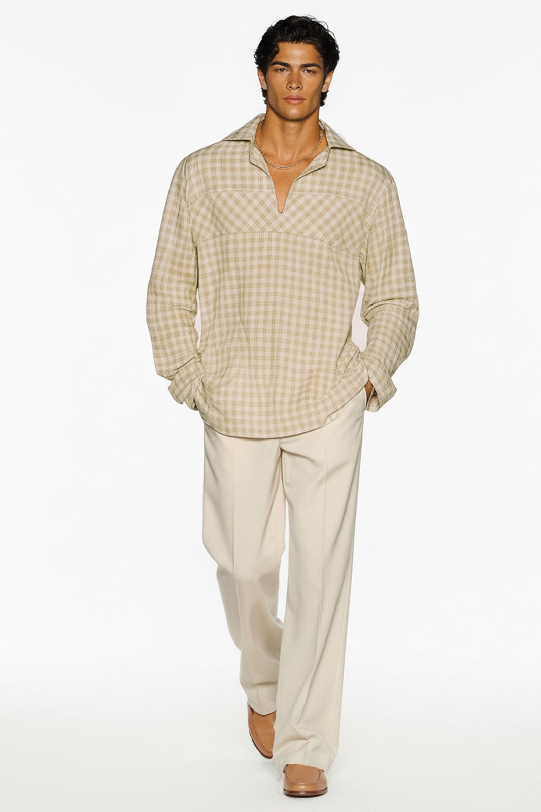 Side view of beige checkered lightweight casual shirt styled with relaxed trousers