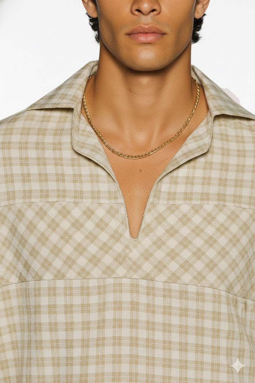 Close-up of beige checkered casual shirt showing open-neck placket and textured pattern